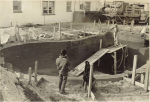 Curtis Pools since 1956. Early black and white photo of an inground pool installation